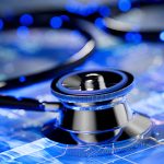 A close-up image of a stethoscope on a futuristic digital background
